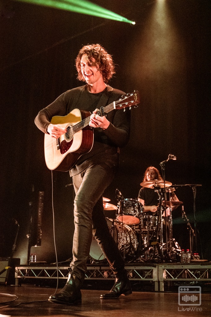 Dean Lewis playing the guitar in Melbourne for his "A Place We Knew Tour"